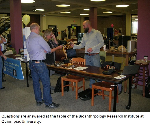 Questions are answered at the table of the Bioanthropology Research Institute at 
                                          Quinnipiac University (B.R.I.C.).