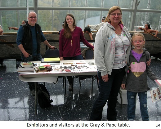 Exhibitors and visitors at the Gray & Pape table. JH