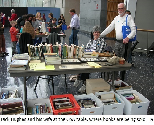 Dick Hughes and his wife at the OSA table., where books are being sold. JH