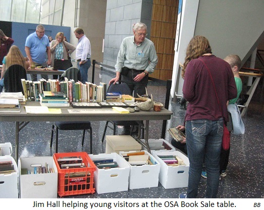 Jim Hall helping young visitors at the OSA Book Sale table. BB