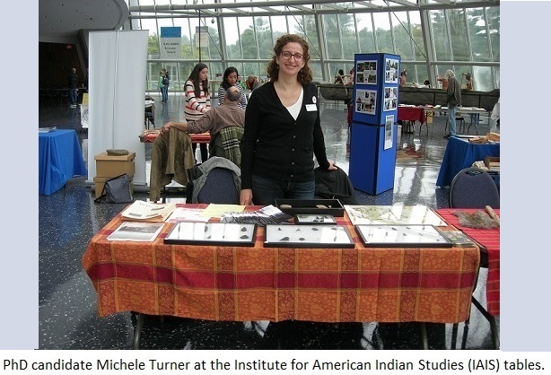 PhD candidate Michele Turner at the Institure of American Indian 
                                           Studies (IAIS) table.