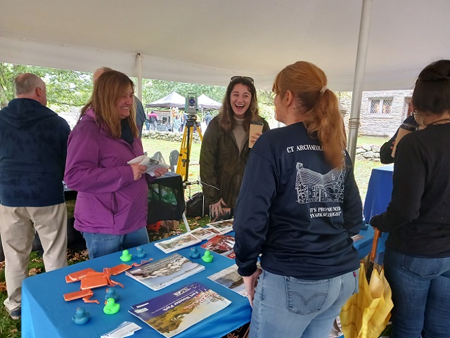October 14, 2023. A quick laugh with CT State Archaeologist Sarah Sportman at the Heritage Consultants table.