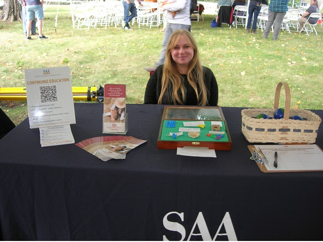 October 5, 2024. Sarah Bowen holds down the fort at the Society for
                                            American Archaeology (SAA) table.